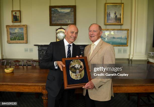 Geoffrey Boycott receives a silver cap from ECB Chairman Colin Graves to commemorate reaching 100 test caps for England during the lucnch break on...