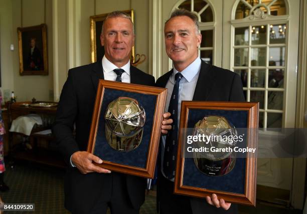 England cricketers Alec Stewart and Graham Thorpe pose with their silver caps commemorating reaching 100 test caps for England during the lucnch...