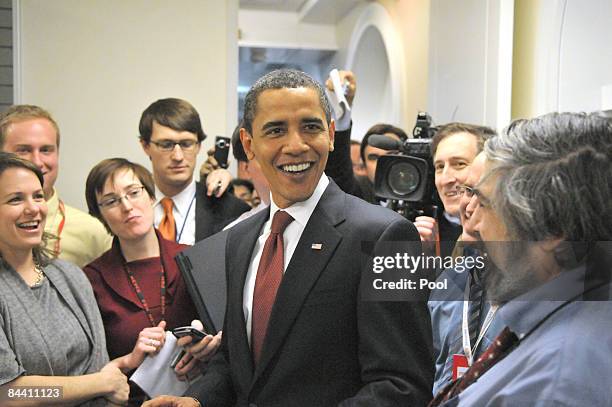 President Barack Obama takes an impromptu tour of the White House press work area January 22, 2009 in Washington, DC. The president made the surprise...