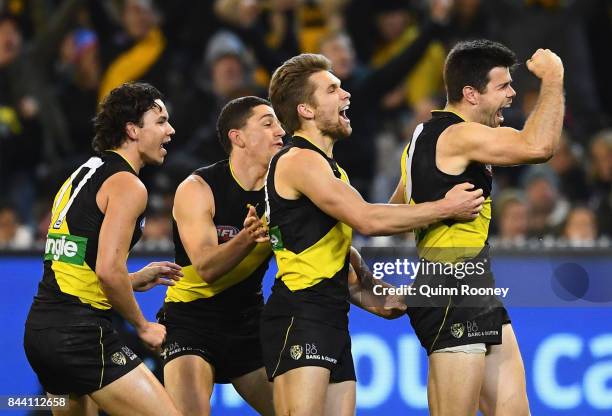 Trent Cotchin of the Tigers celebrates kicking a goal during the AFL Second Qualifying Final Match between the Geelong Cats and the Richmond Tigers...