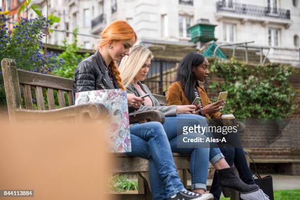 young beautiful women in the park - greater london stock pictures, royalty-free photos & images