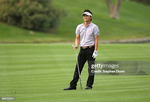 Ryuji Imada of Japan watches his second shot on the seventh hole on the Palmer Private Course at PGA West during the second round of the Bob Hope...