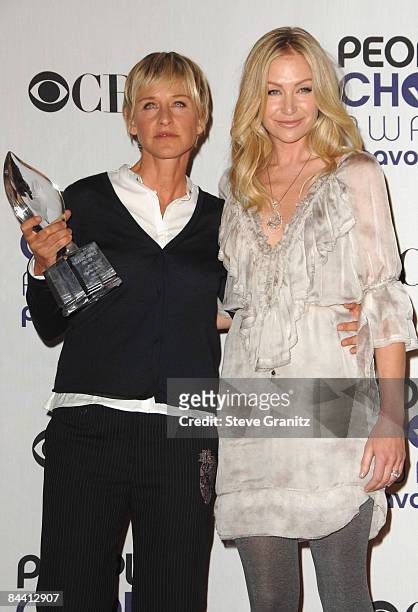 Personality Ellen DeGeneres and Actress Portia de Rossi poses in the press room at the 35th Annual People's Choice Awards held at the Shrine...