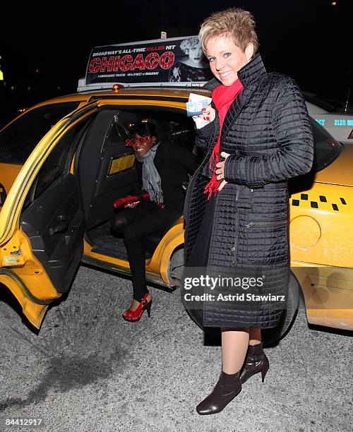 Guests pose for photos during the distribution of debit cards for free yellow cab fares on New Year's Eve hosted by Ciroc Vodka on December 31, 2008...