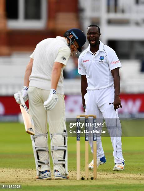 Kemar Roach of the West Indies celebrates taking the wicket of Jonny Bairstow of England during day two of the 3rd Investec Test Match between...