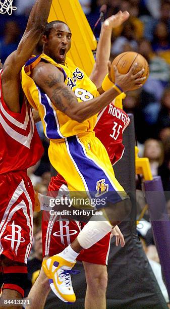 Kobe Bryant of the Los Angeles Lakers attempts a shot during the NBA game between the Los Angeles Lakers and the Houston Rockets at the Staples...