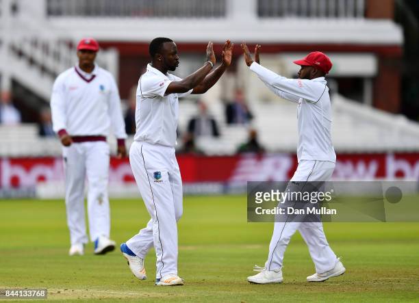 Kemar Roach of the West Indies celebrates taking the wicket of Jonny Bairstow of England during day two of the 3rd Investec Test Match between...