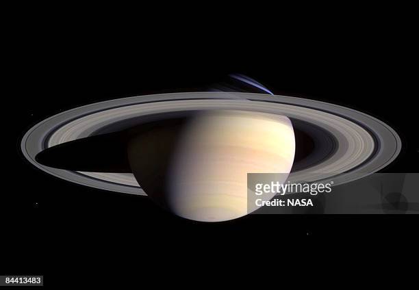 Saturn's peaceful beauty invites the Cassini spacecraft for a closer look in this natural color view, taken during the spacecraft's approach to the...