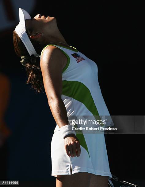 Ai Sugiyama of Japan reacts after a point in her third round match against Jelena Jankovic of Serbia during day five of the 2009 Australian Open at...