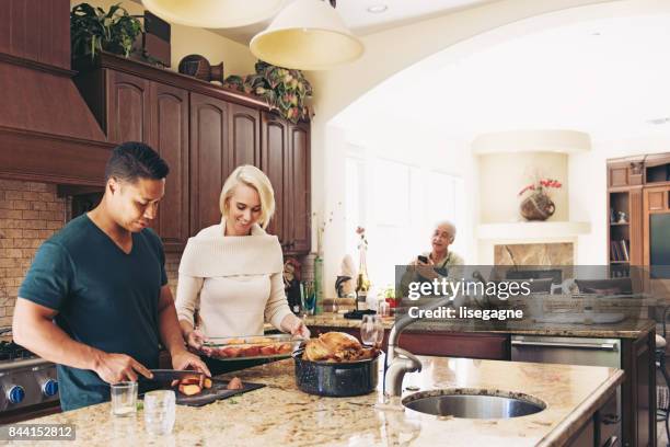 couple prepararing thanksgiving dinner - cooker dial stock pictures, royalty-free photos & images