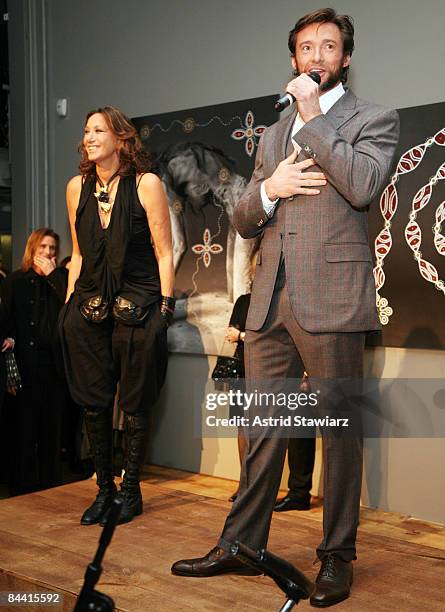 Actor Hugh Jackman speaks beside fashion designer Donna Karan during the Nomad Two Worlds Preview Exhibit at the Stephan Weiss Gallery on January 22,...