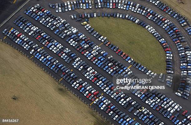 This file picture taken on December 18, 2008 shows thousands of new cars stored on the runway at the disused Upper Heyford airbase near Bicester,...