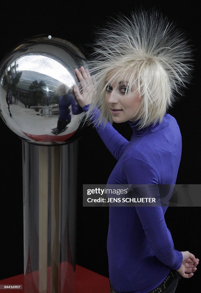 Fair hostess Tanja has her hair electrif