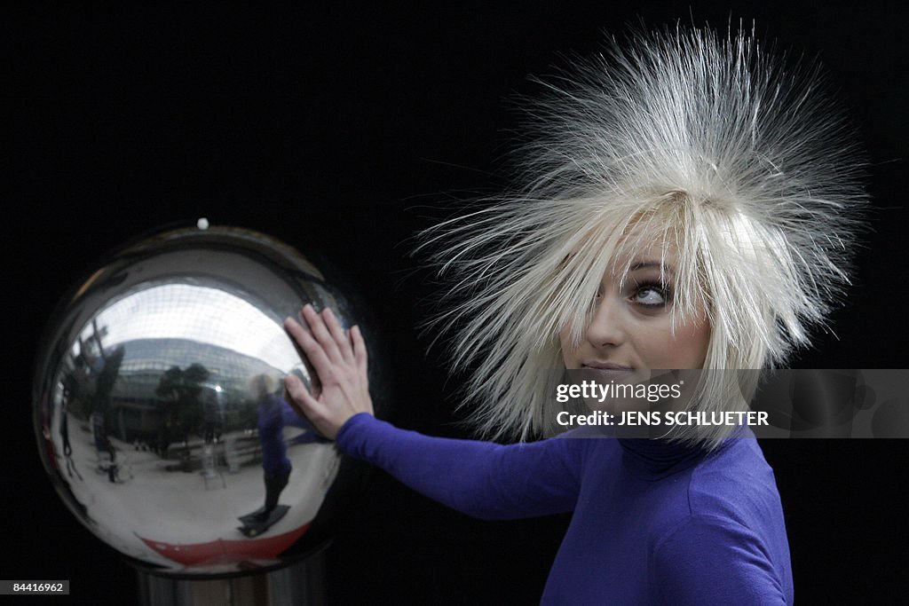 Fair hostess Tanja has her hair electrif