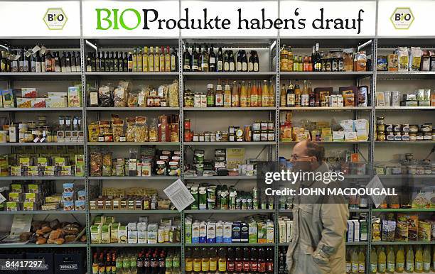 Visitor walks past a shelf displaying organic "bio" food products at the International Green Week Food and Agriculture Trade Fair in Berlin January...