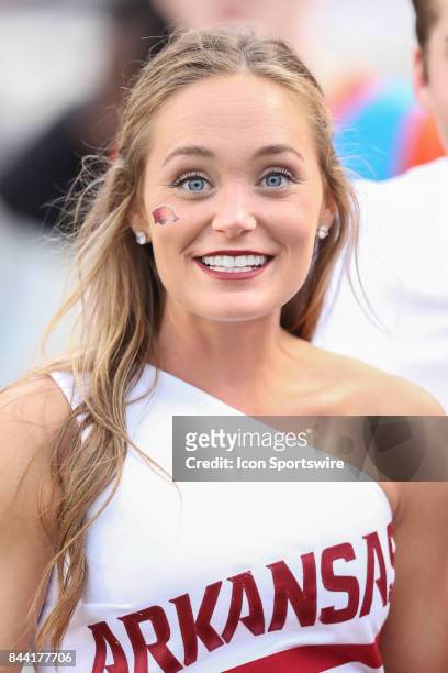 Razorback cheerleader smiles at the crowd during the game between the Florida A&M Rattlers and the Arkansas Razorbacks on August 31, 2017 at War...