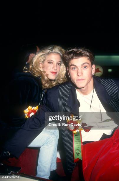American actress Tori Spelling and American actor Brian Austin Green pose for a portrait during the 61st Annual Hollywood Christmas Parade on...