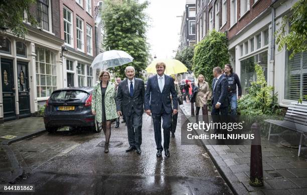 Dutch King Willem-Alexander visits the Amsterdam neighborhood the "Jordaan" with the mayor Eberhard van der Laan in Amsterdam, the Netherlands, on...