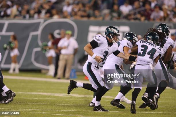 Matt McGloin of the Philadelphia Eagles hands off against the New York Jets during their preseason game at MetLife Stadium on August 31, 2017 in East...