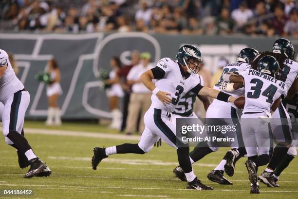 Matt McGloin of the Philadelphia Eagles hands off against the New York Jets during their preseason game at MetLife Stadium on August 31, 2017 in East...