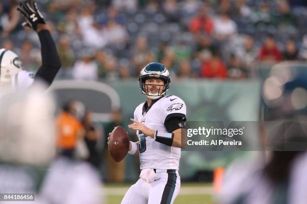 Matt McGloin of the Philadelphia Eagles passes the ball against the New York Jets during their preseason game at MetLife Stadium on August 31, 2017...