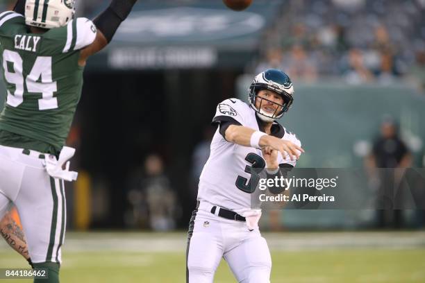 Matt McGloin of the Philadelphia Eagles passes the ball against the New York Jets during their preseason game at MetLife Stadium on August 31, 2017...
