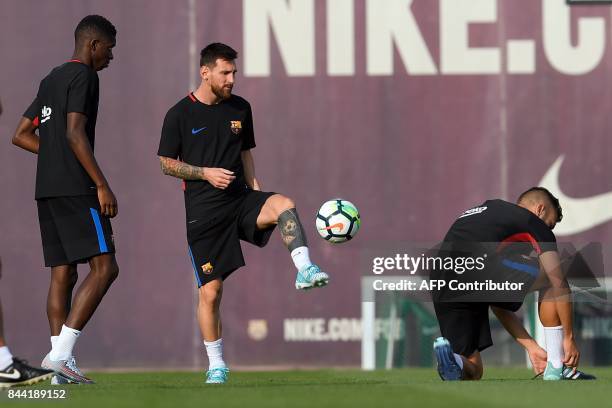 Barcelona's Argentinian forward Lionel Messi controls the ball during a training session at the Sports Center FC Barcelona Joan Gamper in Sant Joan...