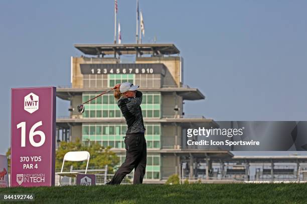 Golfer Stacy Lewis tees off on the 16th hole with the Indianapolis Motor Speedway Pagoda in the background during the second round of the Indy Women...