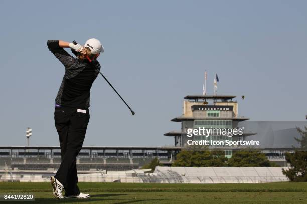 Golfer Stacy Lewis tees off on the 15th hole with the Indianapolis Motor Speedway Pagoda in the background during the second round of the Indy Women...
