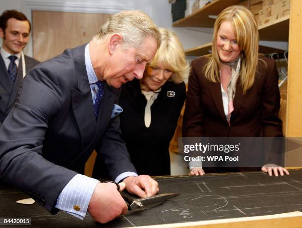 Prince Charles and Camilla, Duchess of Cornwall are seen with cutter Kathryn Sargent during a visit to Gieves & Hawkes, a bespoke tailor on January...
