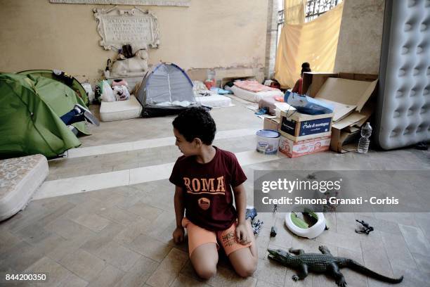 Dozens of families including children continue to live in the colonnade of Basilica of the 12 Apostles in Piazza SS Apostoli, on September 8, 2017 in...