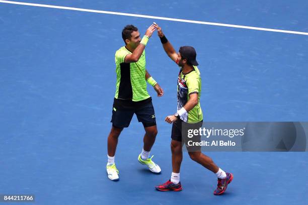 Jean-Julien Rojer of the Netherlands and Horia Tecau of Romania celebrate after defeating Feliciano Lopez and Marc Lopez of Spain during the Men's...