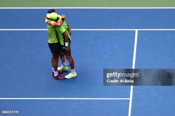 Jean-Julien Rojer of the Netherlands and Horia Tecau of Romania celebrate after defeating Feliciano Lopez and Marc Lopez of Spain during the Men's...