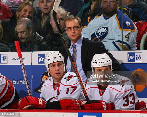 Head coach Paul Maurice, Anton Babchuk, and Rod Brind'Amour of the Carolina Hurricanes watch the play against the Buffalo Sabres on January 17, 2009...