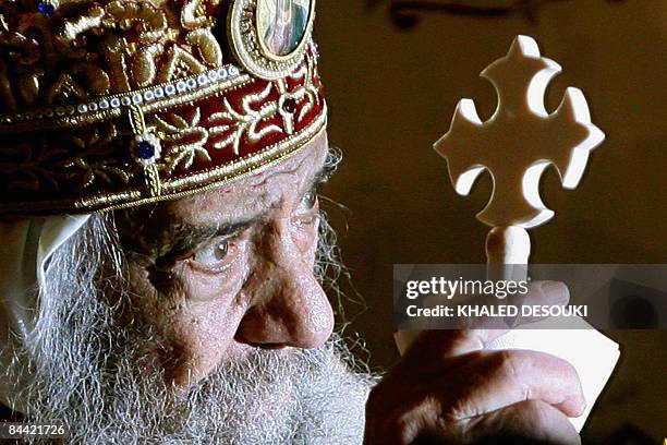 Pope Shenuda III, Head of the Egyptian Coptic Orthodox Church, leads the Coptic Christmas midnight mass in Cairo late on January 6,2009. Pope...