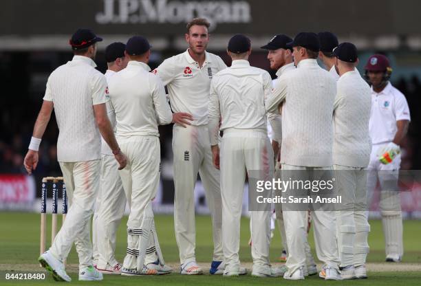 Stuart Broad of England celebrates with teammates after taking the wicket of Kyle Hope of West Indies during day two of the 3rd Investec Test match...