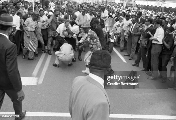 Detroit policemen struggle with an unidentified man who tried to stop the 6/23 'Walk to Freedom' march by over 100,000 persons demonstrating in...