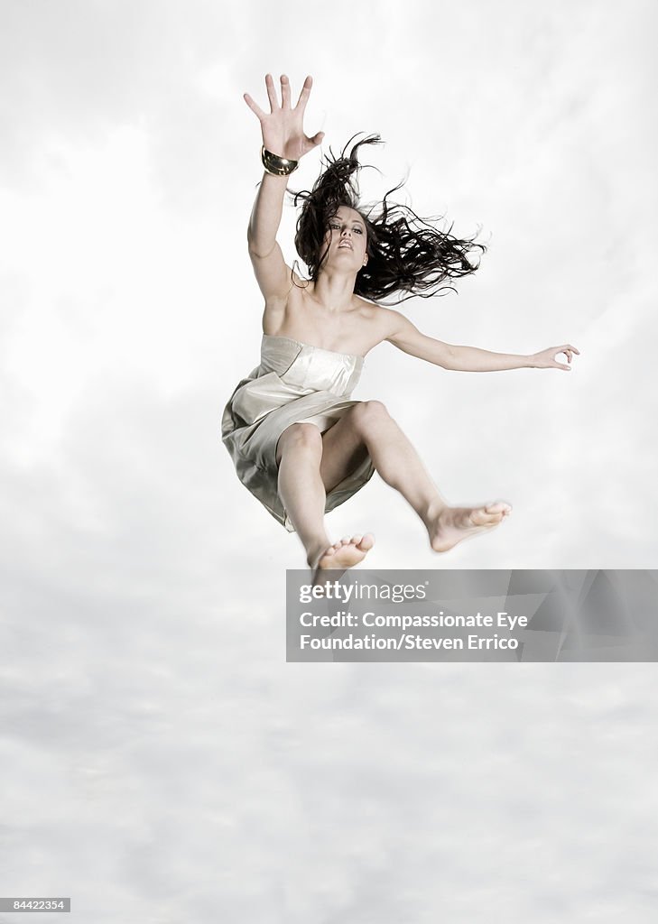 Young woman falling through the air