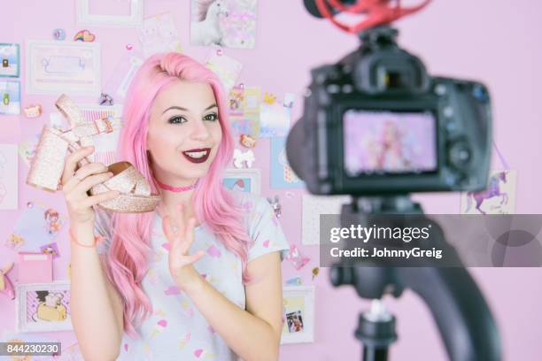 female vlogger making social media video about fashion shoes for the internet - clubwear stock pictures, royalty-free photos & images
