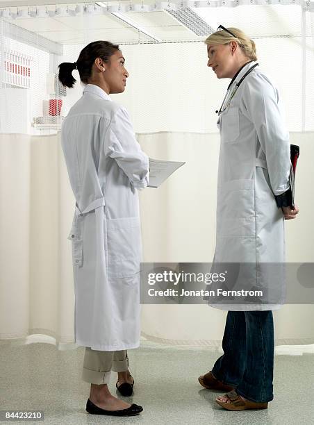 two doctors discussing - doctor profile view stock pictures, royalty-free photos & images