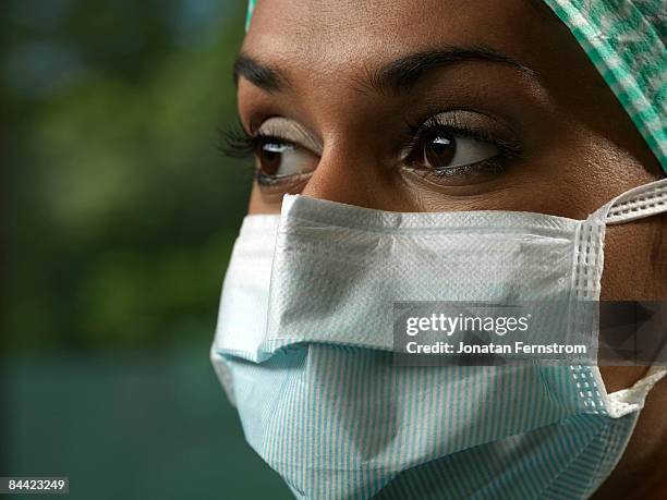 portrait of a nurse - protective face mask side stock pictures, royalty-free photos & images