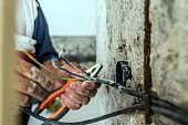 Photo of Hand striping the insulation of wires