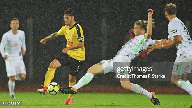 Jesper Verlaat of Bremen tackles Manuel Farrona Pulido of Koeln during the 3. Liga match between SV Werder Bremen II and SC Fortuna Koeln at Platz 11...