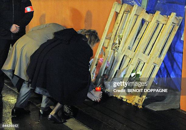 Princess Mathildde and Prince Philippe of Belgium light a candle at the entrance to the children's day care centre 'Fabeltjesland' in Sint-Gillis,...