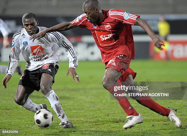 Vannes' Cameroonian defender Eugene Claude Ekobo vies with Ajaccio's Malian forward Georges Ba during the French cup football match Ajaccio vs....
