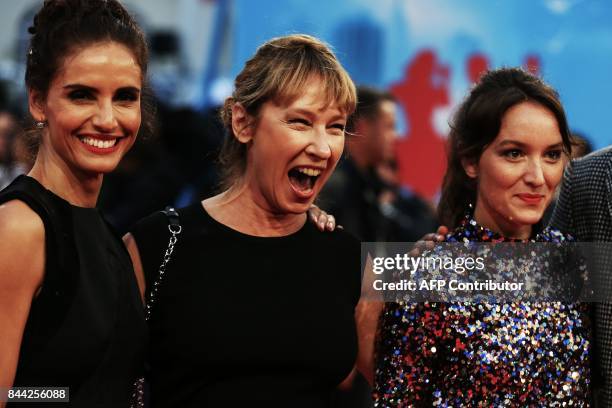 French actress Emmanuelle Bercot laughs, flancked by French-Chilean actress Leonor Varela and French actress Anais Demoustier, as they pose on the...