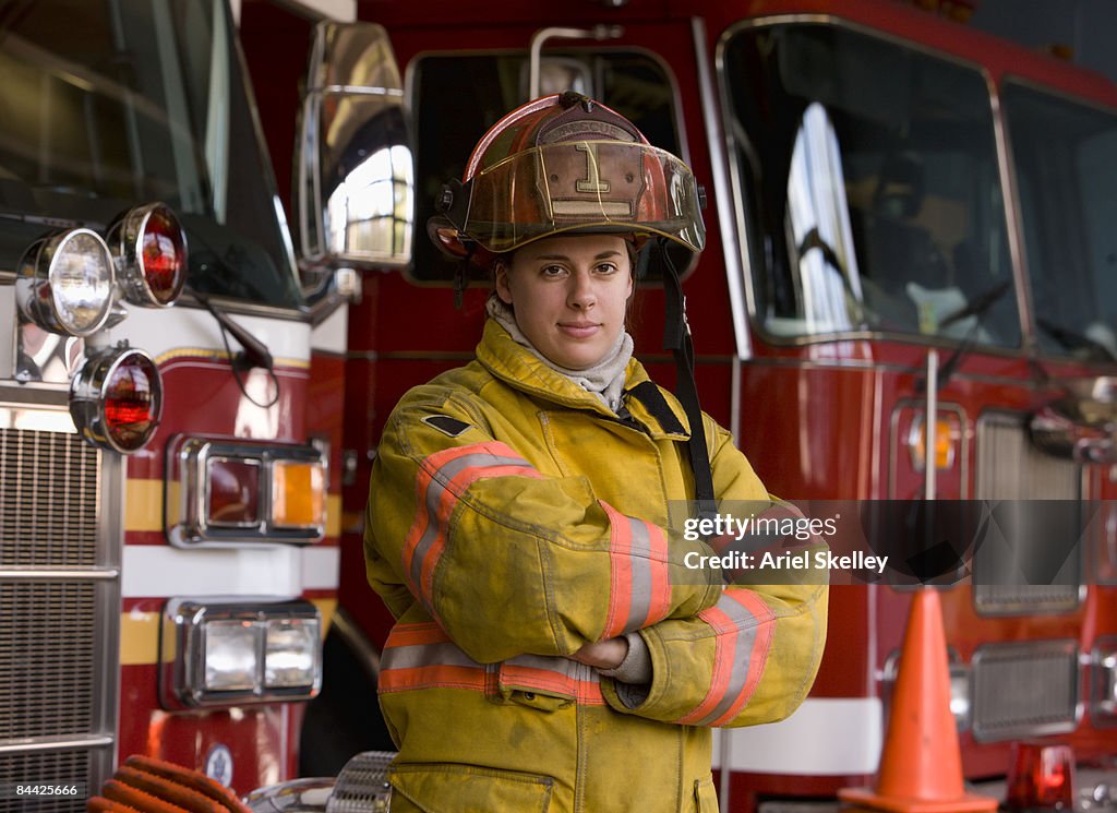 Portrait of Female Fire Fighter in Fire Station