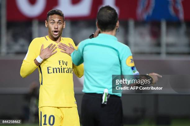 Paris Saint-Germain's Brazilian forward Neymar reacts to a referee's decision during the French L1 football match between Metz and Paris...