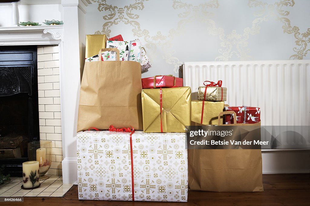 Presents in shopping bags in living room.