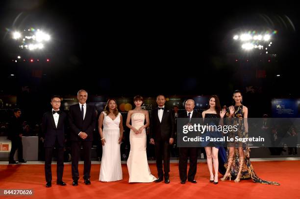 Festival director Alberto Barbera , Angeles Woo, Ha Ji-Won, Zhang Hanyu, John Woo, Qi Wei, Tao Okamoto and guest walk the red carpet ahead of the...